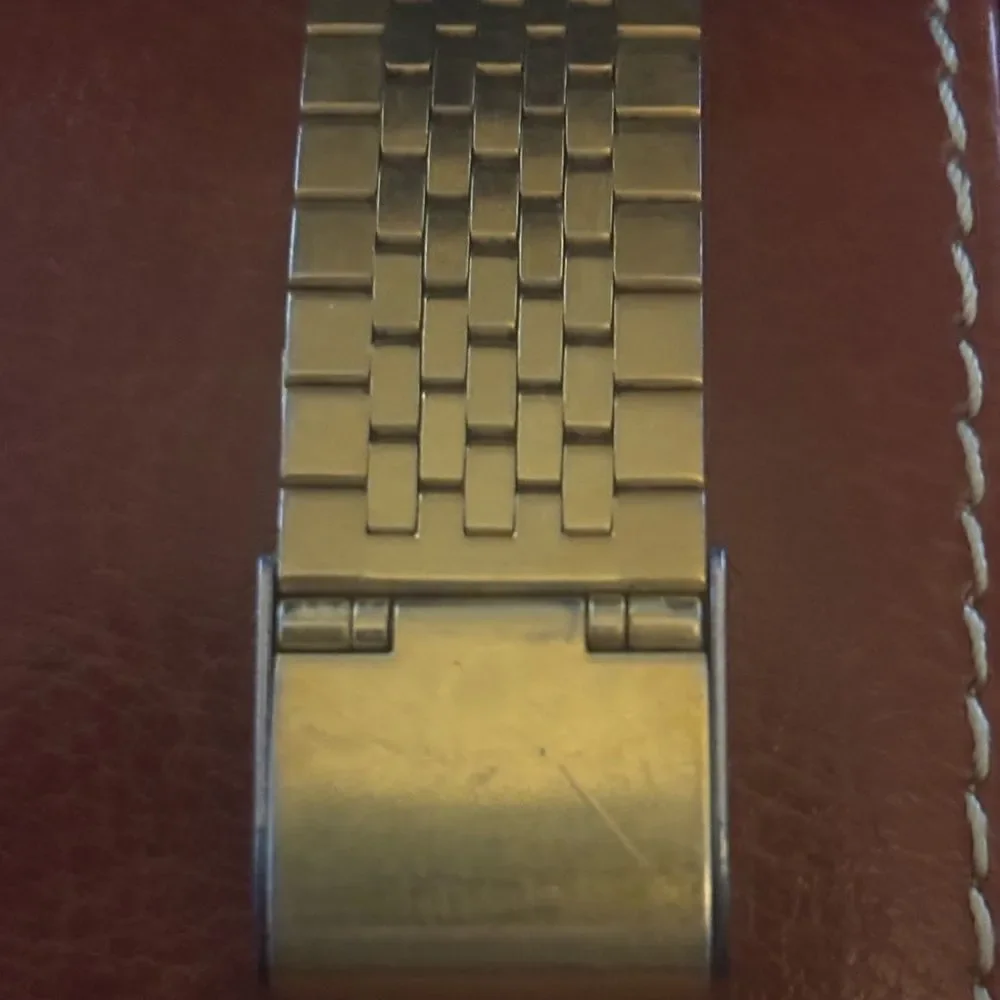 Vintage Pulsar By Seiko Gold Tone Date Watch with a sleek Black Dial